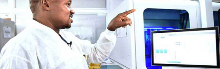 Kenya Medical Research Institute Deputy Director Matilu Mwau explains how the Cobas 880 automated testing machine works in Nairobi on April 8, 2020. It is capable of testing 5,000 Covid-19 samples in a day. PHOTO | EVANS HABIL, NATION MEDIA GROUP